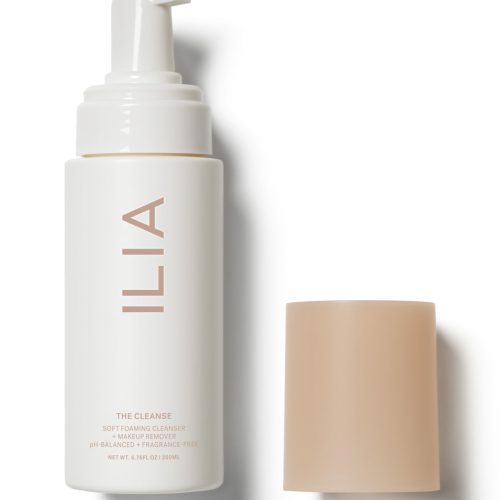 ILIA soft foaming cleanser bottle with its beige cap placed beside it.